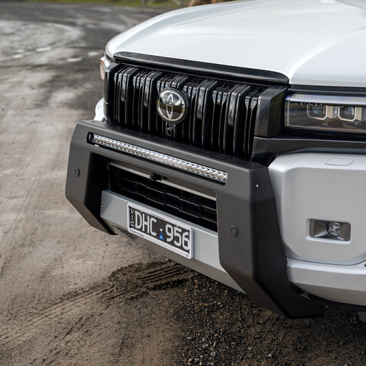 Close-up of Dulux Mannex Black textured powder coat and Satin Silver centre pan on Ultimate9 Prado Nudge Bar.