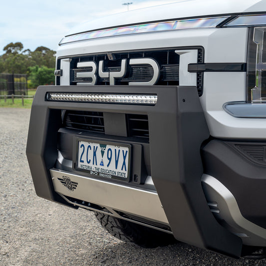 Close-up of Dulux Mannex Black textured powder coat and Satin Silver centre pan on Ultimate9 BYD Shark 6 Nudge Bar.